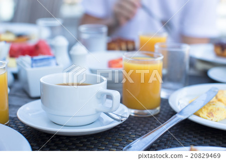 Delicious tasty cappuccino and fresh juice for 20829469