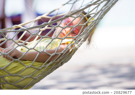 Adorable little girl on tropical vacation relaxing 20829677