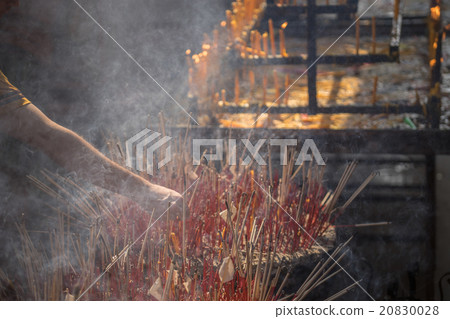 Incense sticks are burning. 20830028