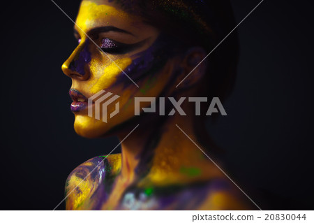 Woman's profile body art against black background 20830044