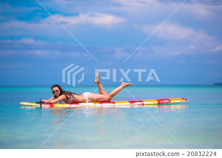 Beautiful surfer woman surfing during summer Beautiful surfer woman surfing during summer 20832224