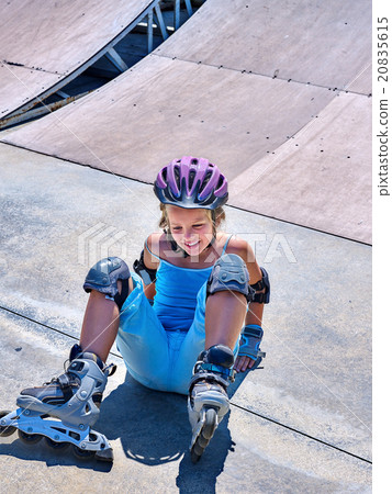 Girl riding on roller skates . Girl riding on roller skates . 20835615