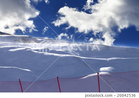 Off-piste slope during a blizzard and sunlight sky 20842536