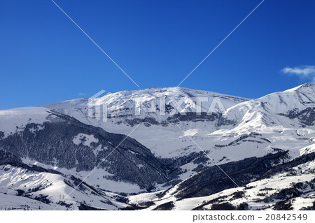 Snowy sunlight mountains at sun morning 20842549