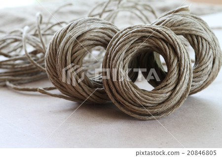A roll of brown coir rope in selective focus 20846805