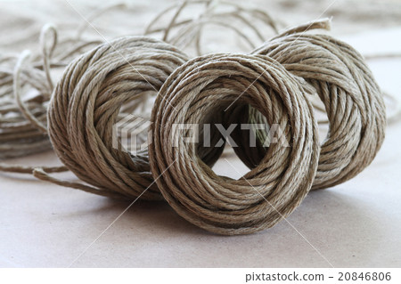 A roll of brown coir rope in selective focus 20846806