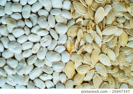Pumpkin white seeds and white beans background 20847347