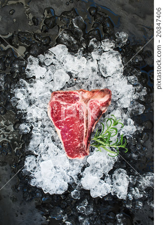 Raw fresh meat t-bone steak on chipped ice with 20847406