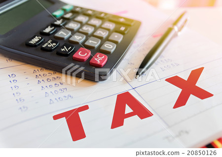 Calculator and pen with words tax. Calculator and pen with words tax. 20850126