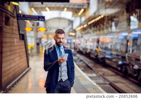 Hipster businessman with smartphone, waiting at Hipster businessman with smartphone, waiting at 20852606