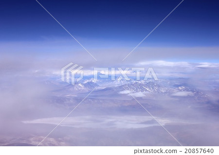 South America Chile Northern part, Andean mountain range of snowfall that appeared from the clouds and a whitish salt lake 20857640