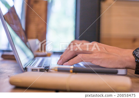 Closeup of businessman hands typing on laptop  20858475