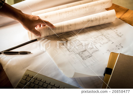 Creative architect projecting on the big drawings Creative architect projecting on the big drawings 20858477