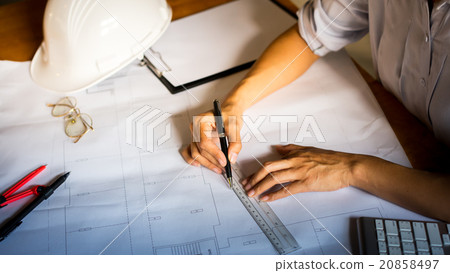 Creative architect projecting on the big drawing Creative architect projecting on the big drawing 20858497