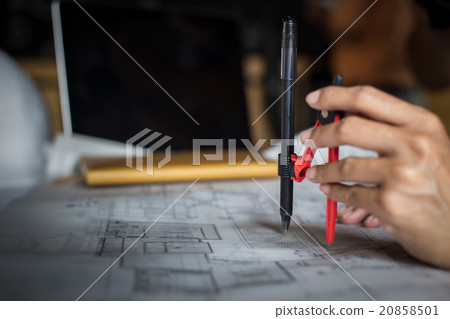 Creative architect projecting on the big drawings Creative architect projecting on the big drawings 20858501