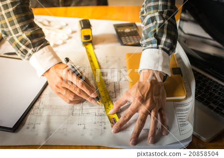 Creative architect projecting on the big drawing Creative architect projecting on the big drawing 20858504