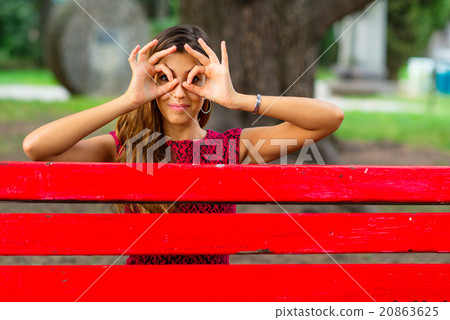 Girl keeps his eyes with his thumb and forefinger Girl keeps his eyes with his thumb and forefinger 20863625