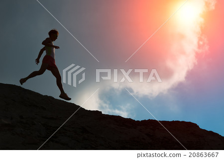 Woman runs on the ridge with colorful sun Woman runs on the ridge with colorful sun 20863667