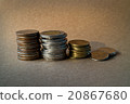 coin stack on brown background 20867680