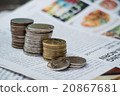 coin stack on newspaper 20867681