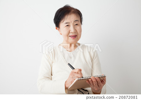 Senior woman personal history writing notes 20872081