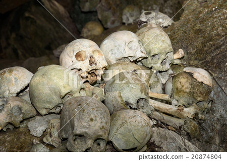Pile of skulls by the entrance to TampangAllo cave Pile of skulls by the entrance to TampangAllo cave 20874804