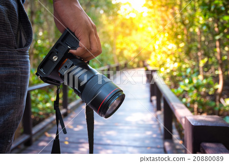 Man holding his camera 20880089