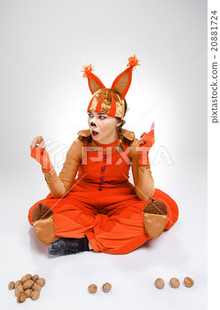 Young woman in the image of red squirrel with 20881724