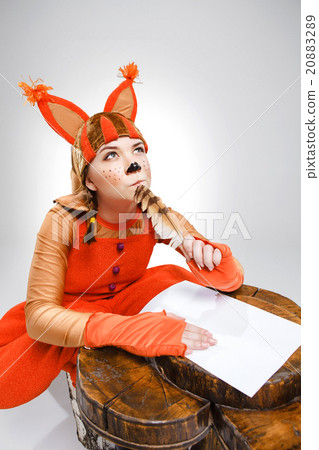 Young woman in image of squirrel writing with 20883289