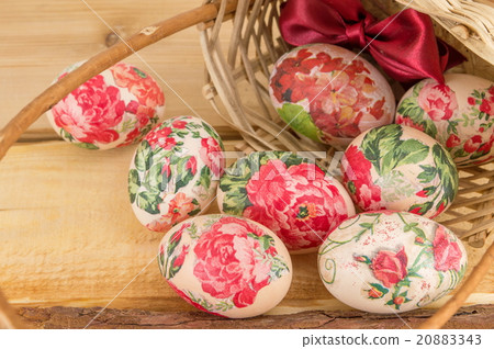 Decorated Easter eggs falling out of basket 20883343