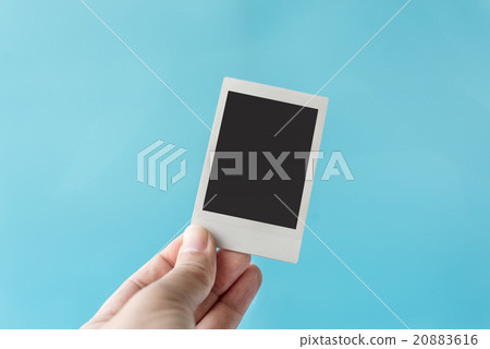 Hand holding blank Instant Photo 20883616