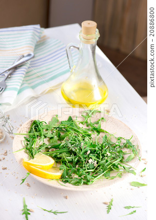 fresh arugula salad with seeds 20886800