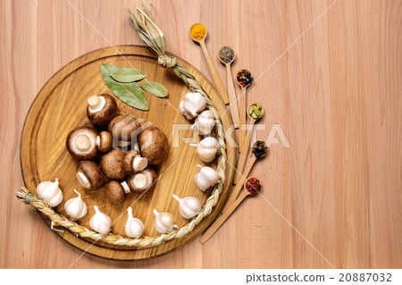 Garlic, mushrooms and spice on wooden table. Garlic, mushrooms and spice on wooden table. 20887032