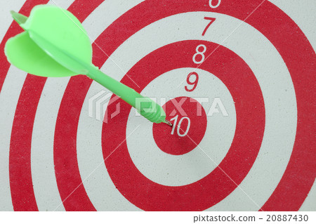 Green dart arrow hitting in the target Green dart arrow hitting in the target 20887430