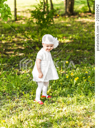 Cute smiling baby girl outdoors Cute smiling baby girl outdoors 20889042