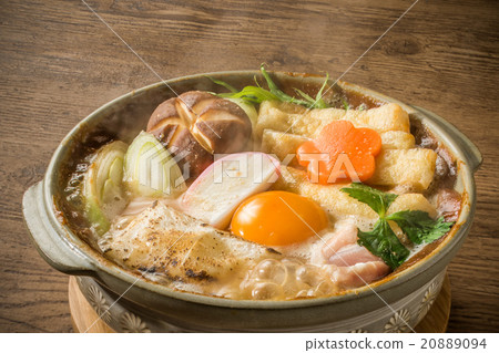 Miso stewed udon in a broth containing miso paste 20889094