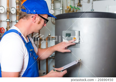 Engineer controlling the heating system 20890450