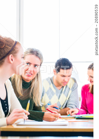 College students having teamwork College students having teamwork 20890539