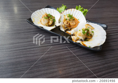 Raw scallops on teriyaki sauce, with copy space 20891498