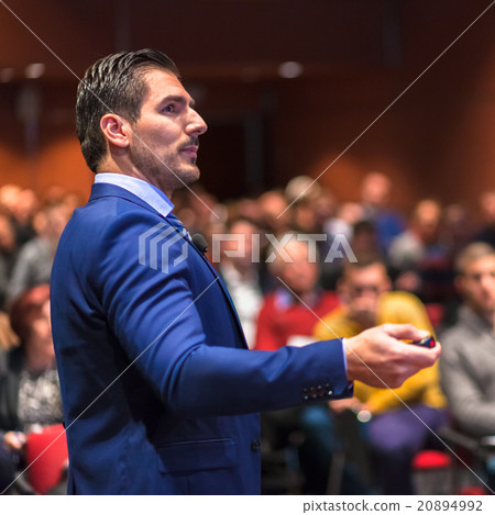 Public speaker giving talk at Business Event. 20894992