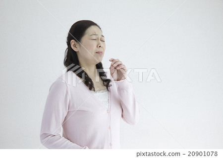 Female in his 40's Female sneezing allergy hay fever natural light white back Female in his 40's Female sneezing allergy hay fever natural light white back 20901078