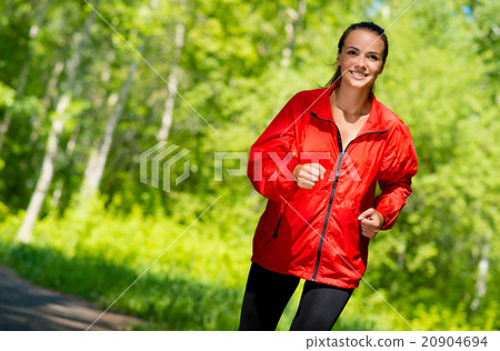 healthy young female athlete running 20904694