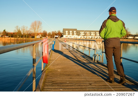 Tourist walk on wharf above  sea to harbor. 20907267