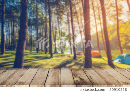 Abstract blurred pine tree and wood table Abstract blurred pine tree and wood table 20910238
