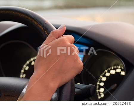 One hand driving car showing meters 20912458