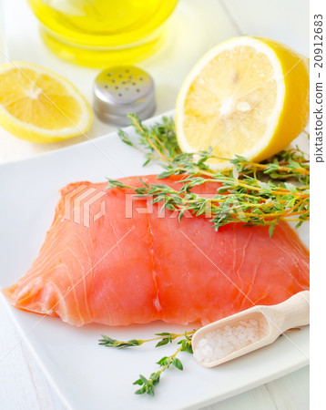 Raw salmon on the white plate with thyme and salt 20912683