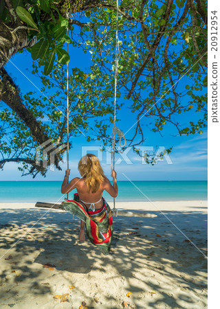 Woman on a swing at Khao Lak white sand beach 20912954