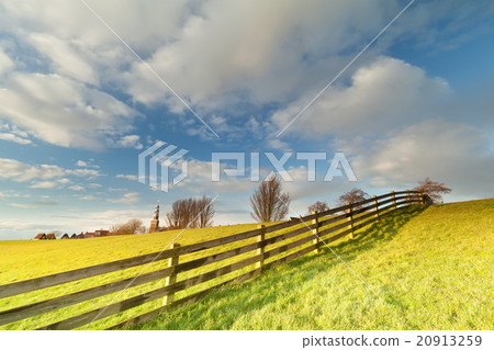 fence on pasture and beautiful sky in Hindeloopen fence on pasture and beautiful sky in Hindeloopen 20913259