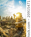 Stones pyramid on sand symbolizing zen 20915471
