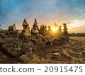 Stones pyramid on sand symbolizing zen 20915475